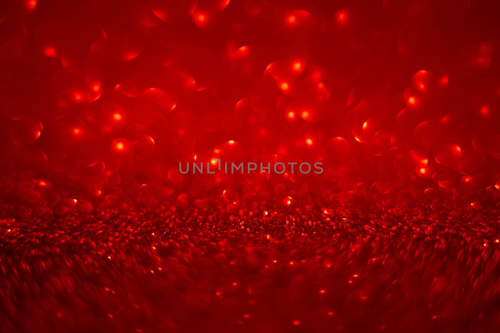 Abstract red holiday background with bokeh defocused lights with copy space for text Christmas Valentines day