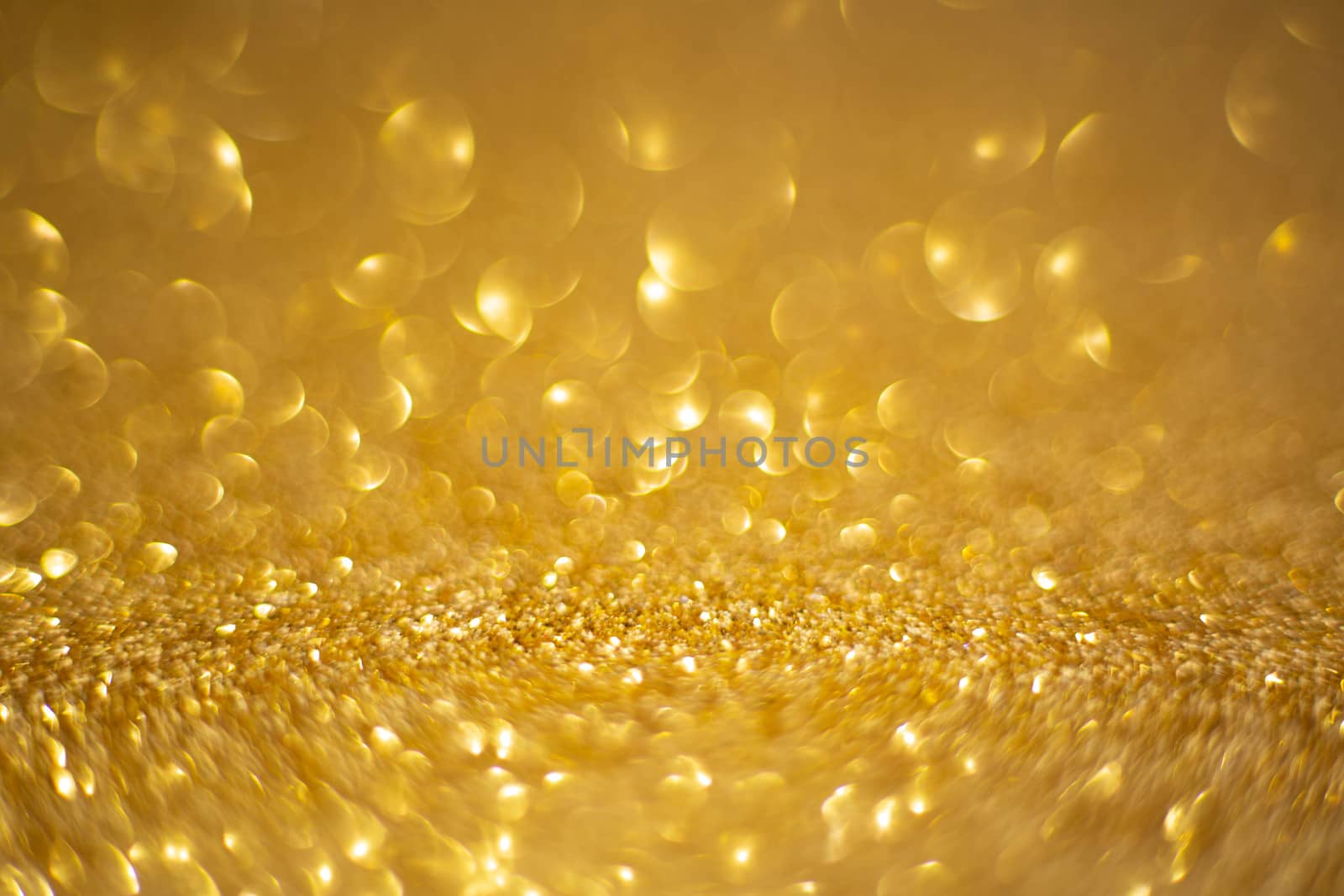 Abstract golden holiday background with bokeh defocused lights with copy space for text