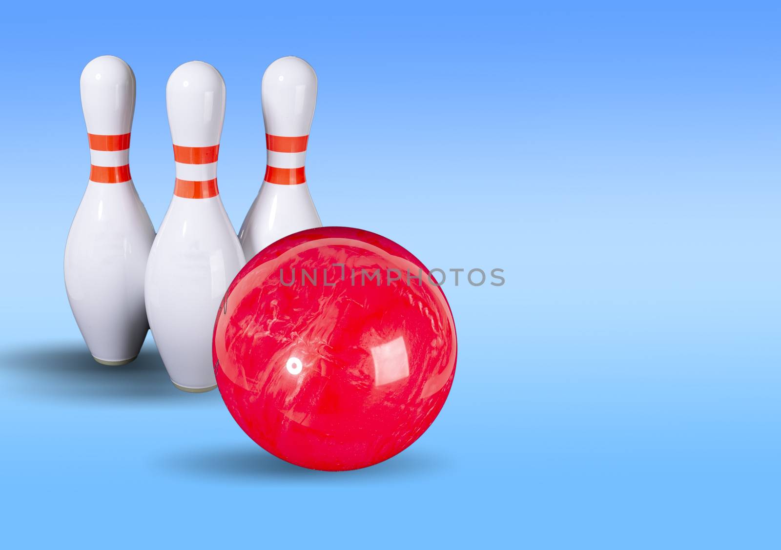 Bowling. Bowling ball and bowling pins on a beautiful light blue background. Place for your inscription. Copy space