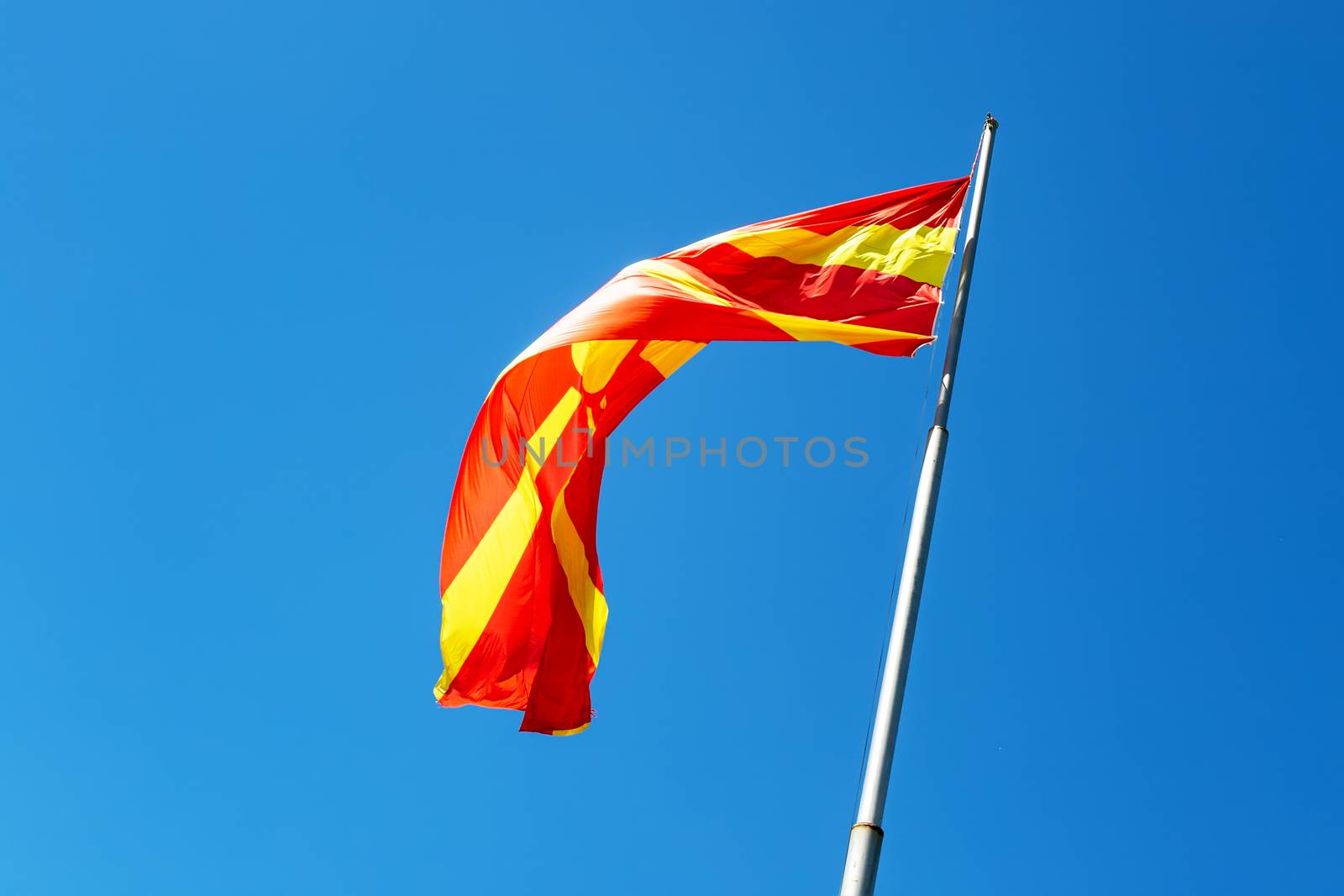 North macedonia flag waving in sunny blue sky by 977_ReX_977