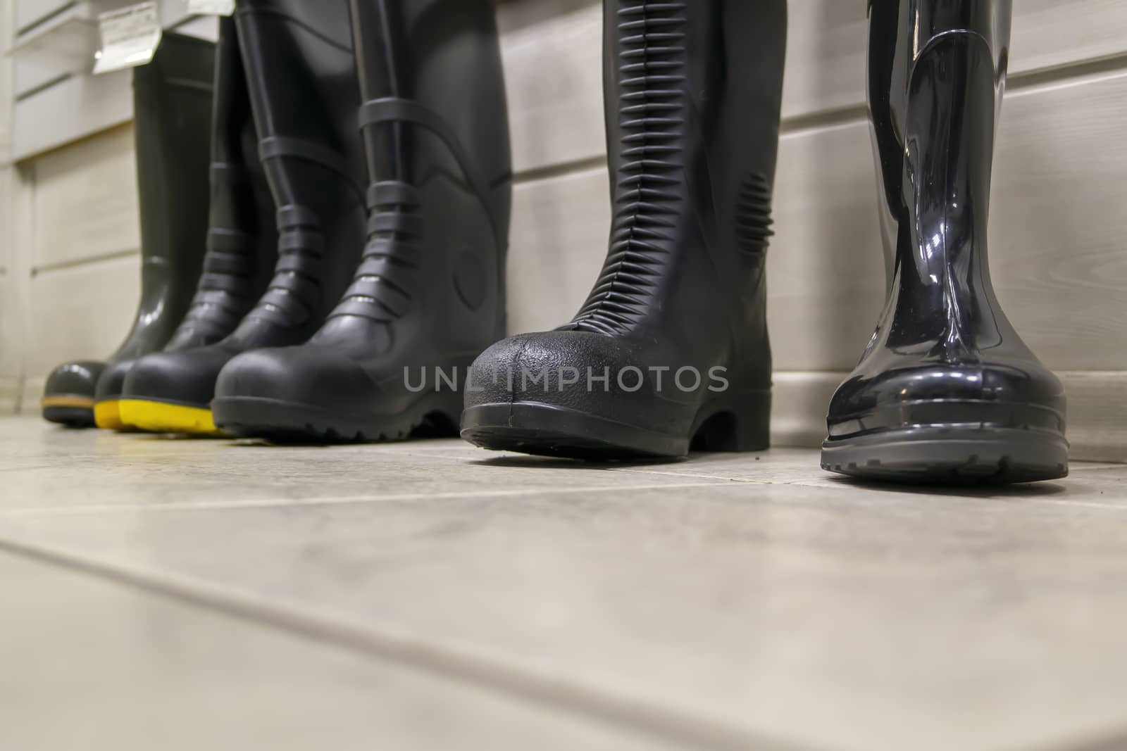 Different rubber boots, work shoes for rainy dirty weather