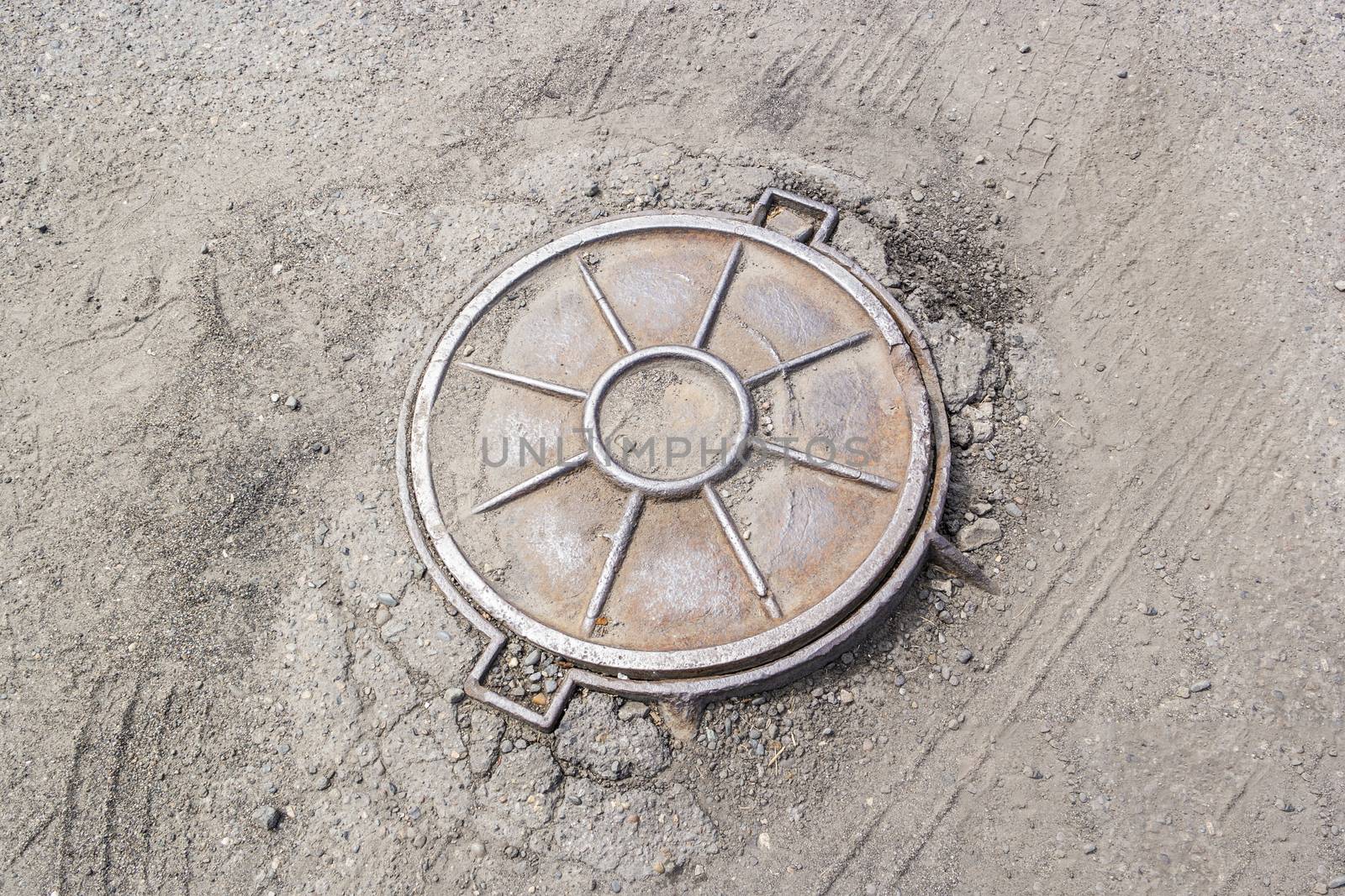 the lid of the sewer hatch,