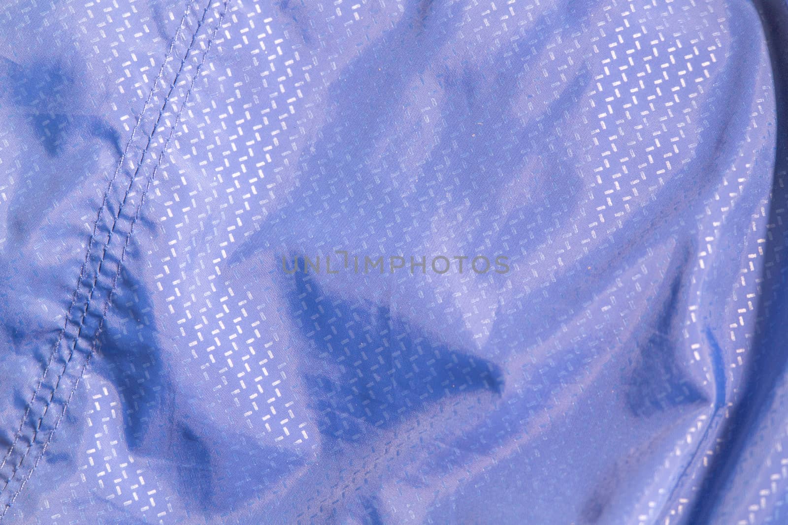 background made of synthetic blue material .texture