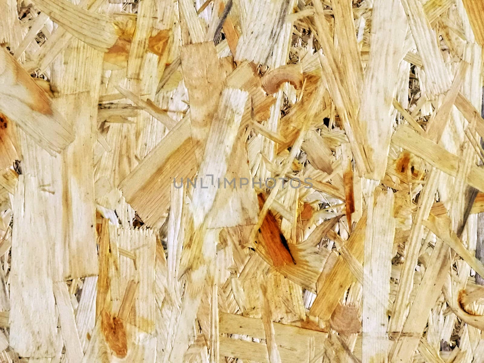 Close up of a recycled compressed wood chipboard. Useful for designers as background