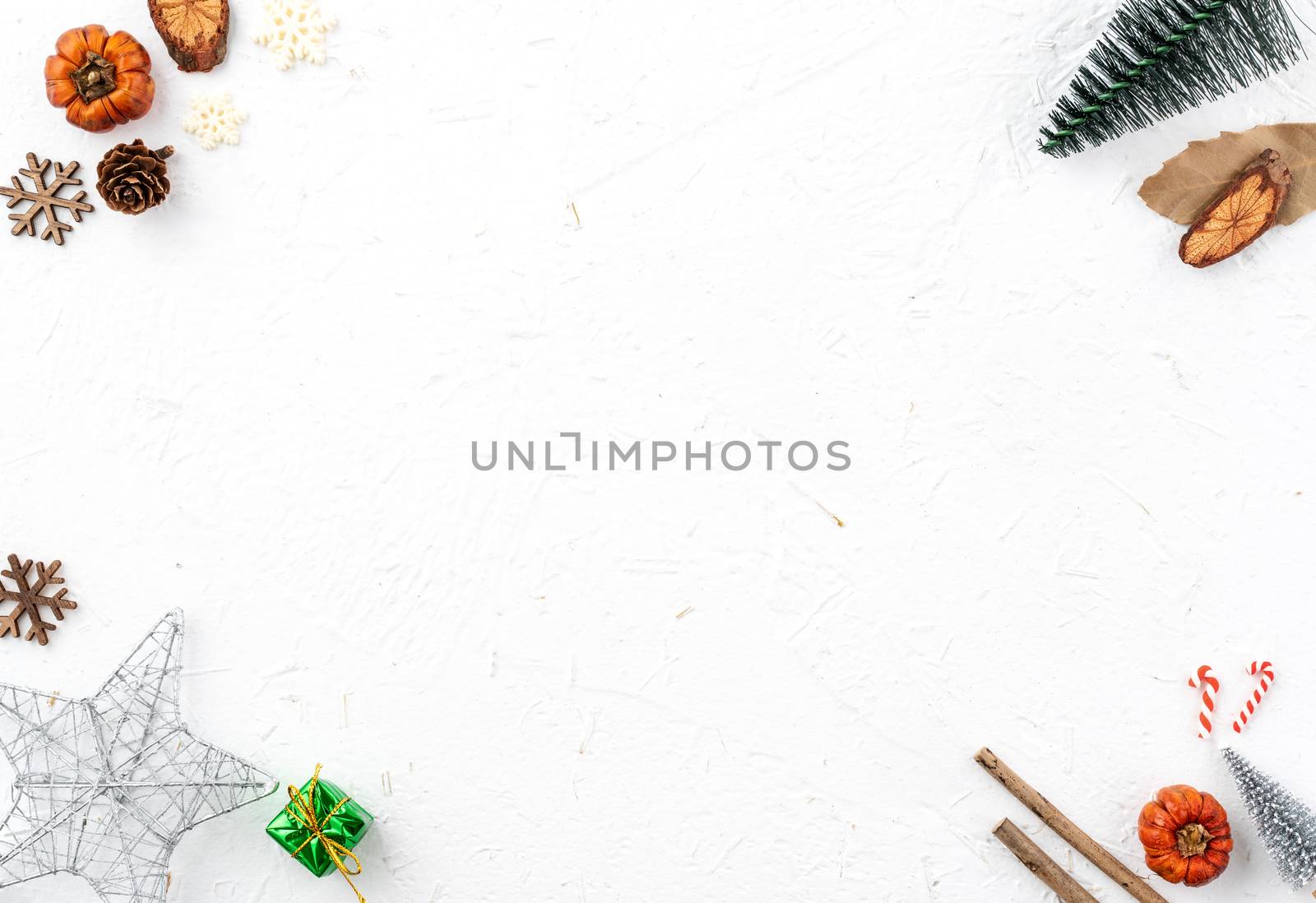 Top view of Christmas holiday decoration ornament composition with Christmas tree, gift star, gingerbread man flat lay with copy space isolated on white background.
