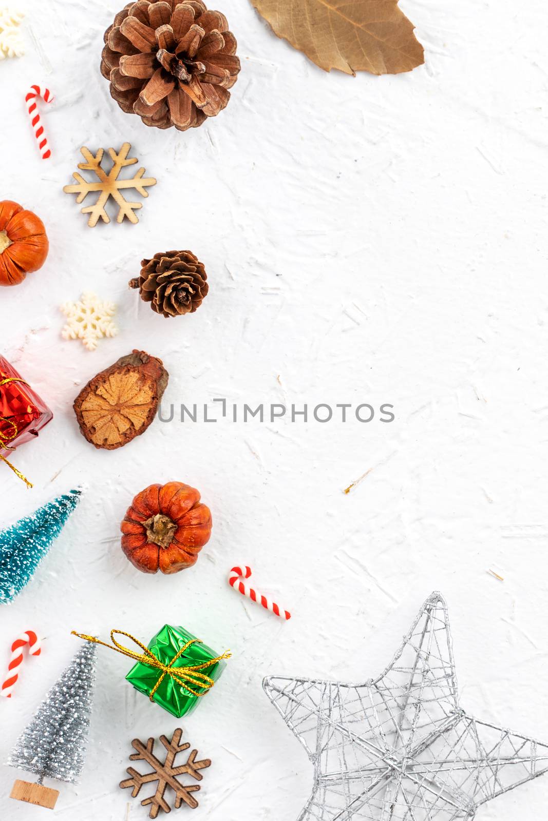 Top view of Christmas holiday decoration ornament composition with Christmas tree, gift star, gingerbread man flat lay with copy space isolated on white background.