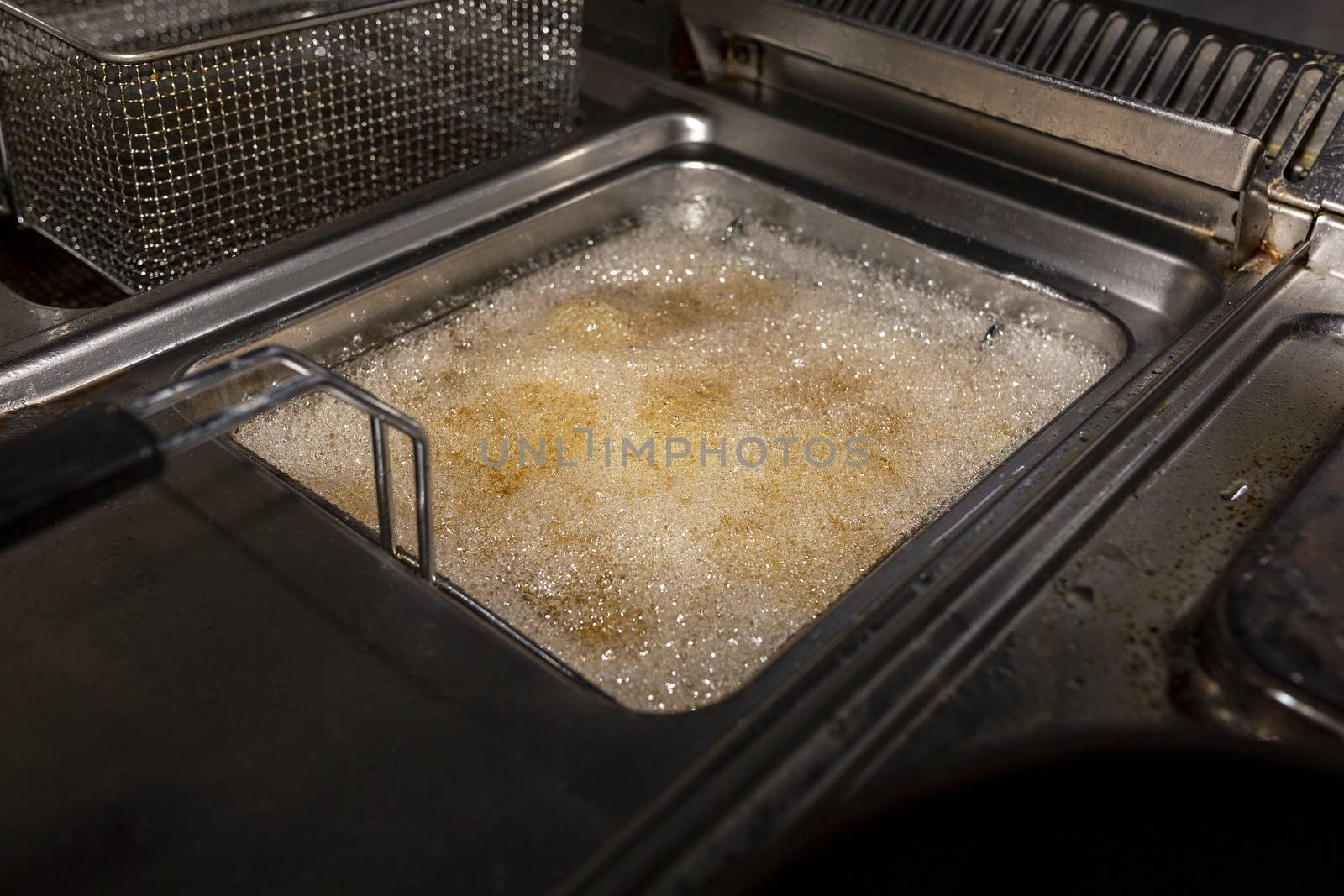 Boiling oil in a container for someanes of fries by 977_ReX_977