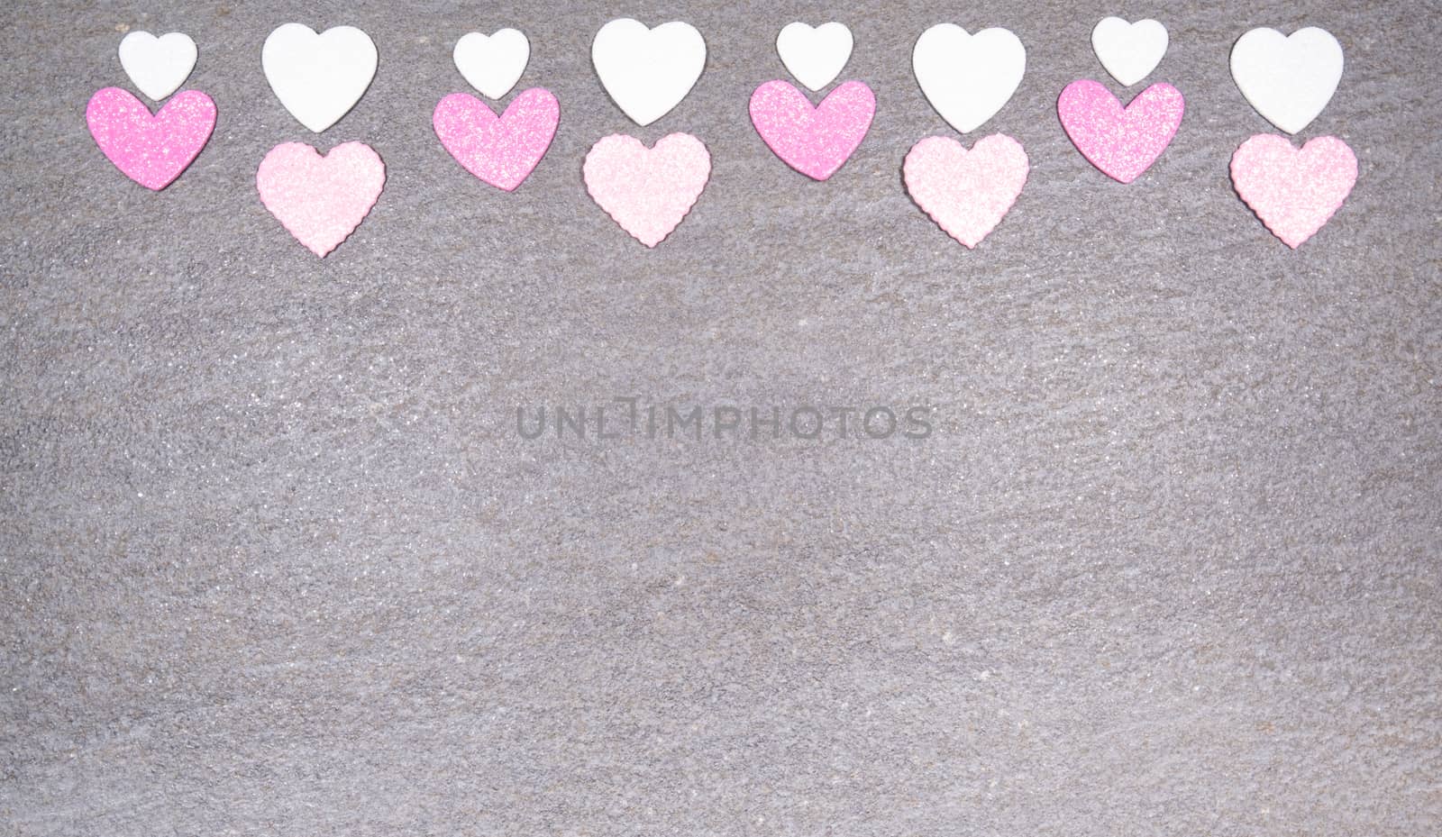 gray granite background with pink and white hearts for valentine by jp_chretien