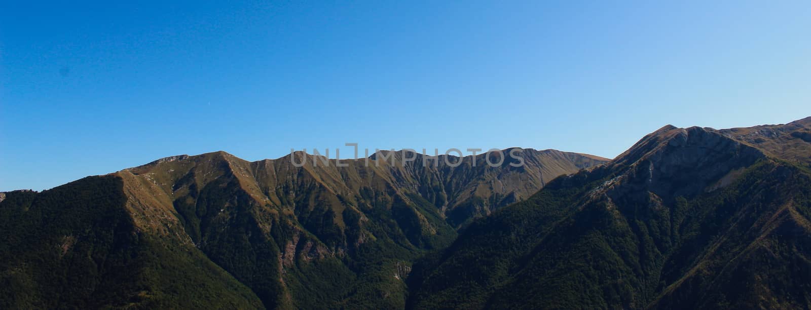 Banner of mountain peaks on Bjelasnica mountain in autumn, with cloudless blue sky in the background. Next to the old Bosnian village of Lukomir. Bjelasnica Mountain, Bosnia and Herzegovina.