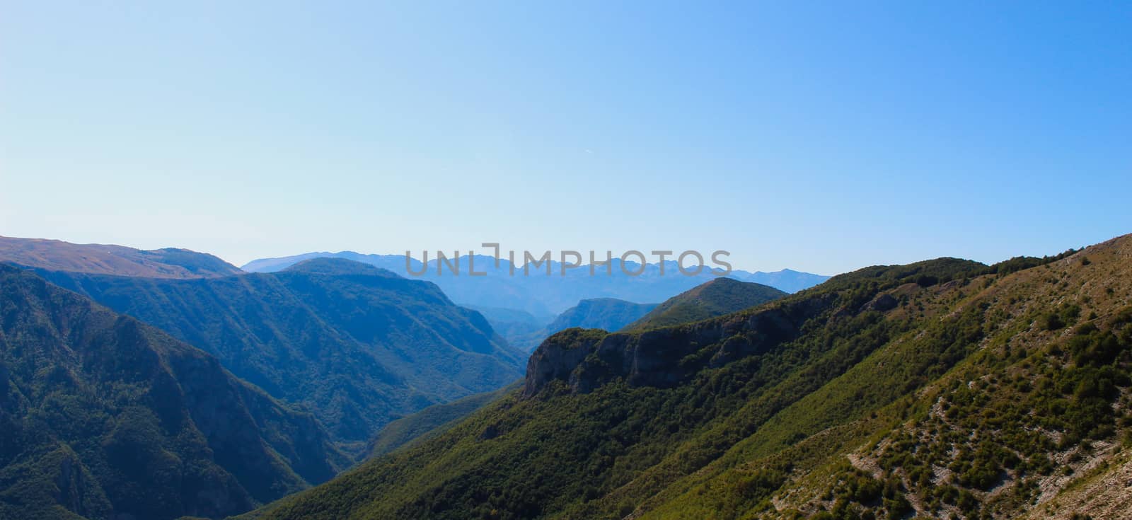 Banner of mountain peaks disappearing in the distance on a beautiful sunny day. Bjelasnica Mountain, Bosnia and Herzegovina.