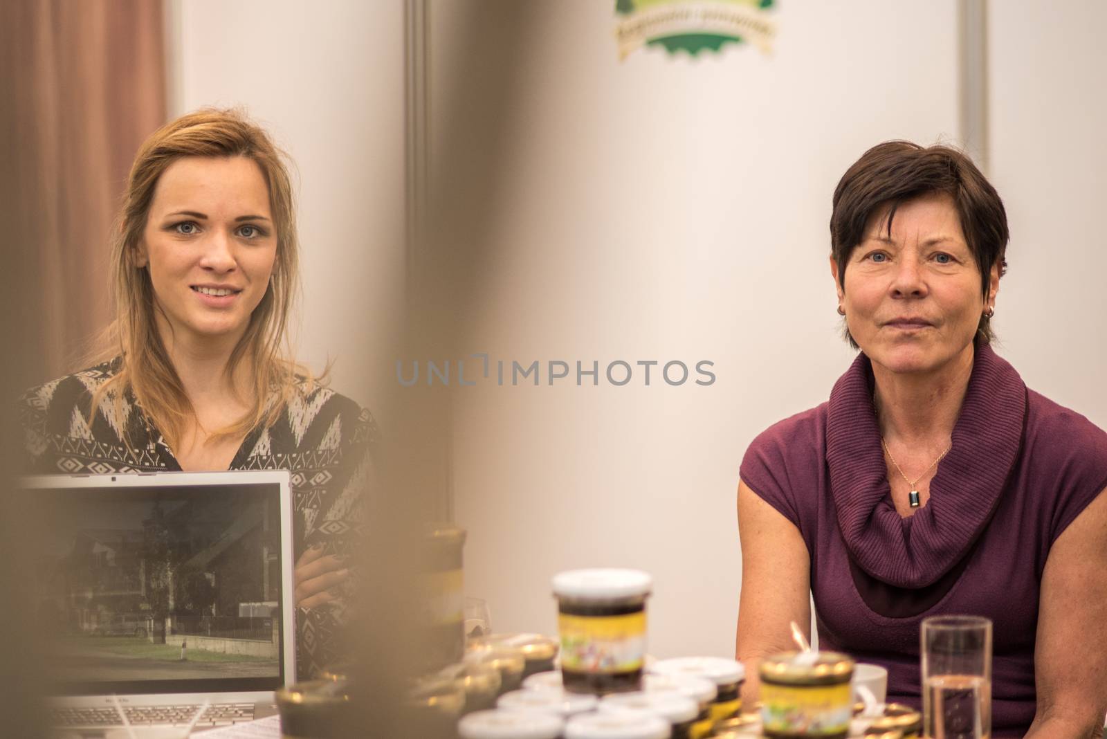 20/05/2018. Brno, Czech Republic. Two women looking at the camera while working at the convention trade center in Brno. BVV Brno Exhibition center. Czech Republic by gonzalobell