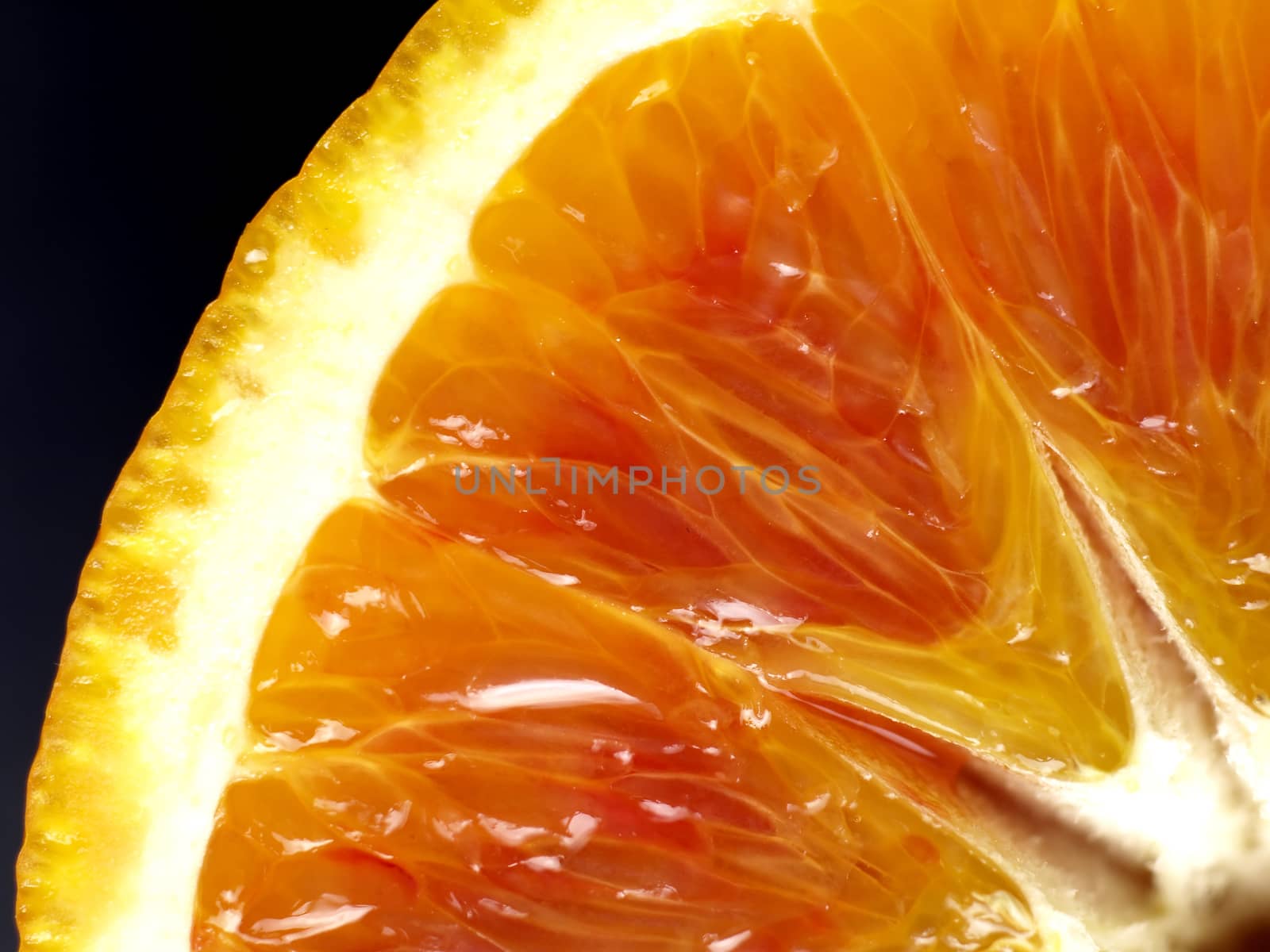 closeup of an orange with black background