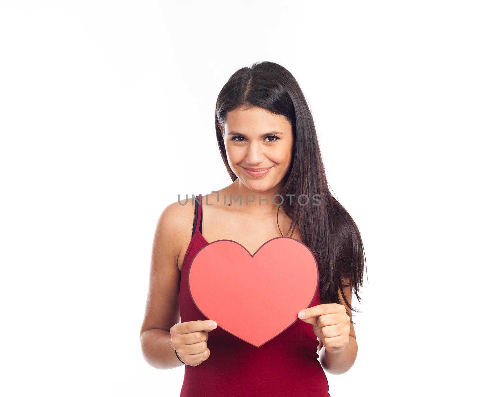 beautiful happy brunette woman holding and showing a big red hea by jp_chretien