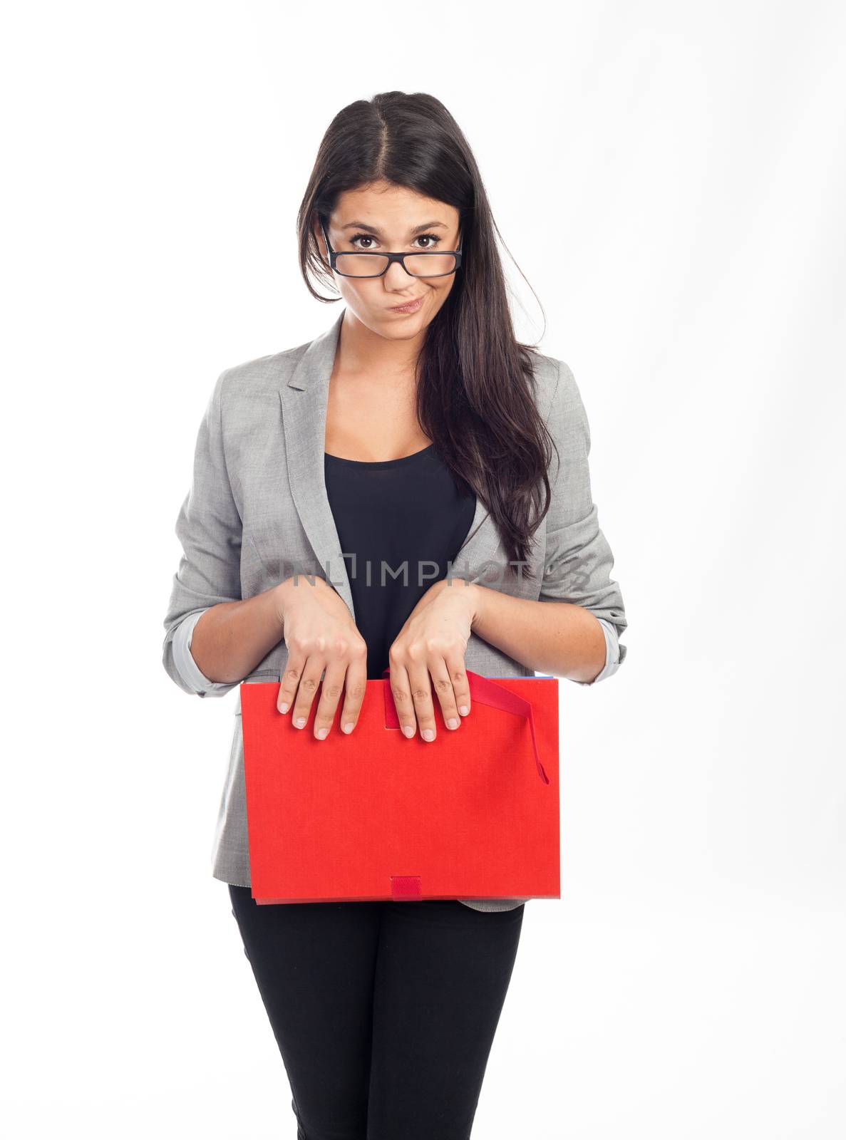 beautiful young businesswoman with red folder making a funny face