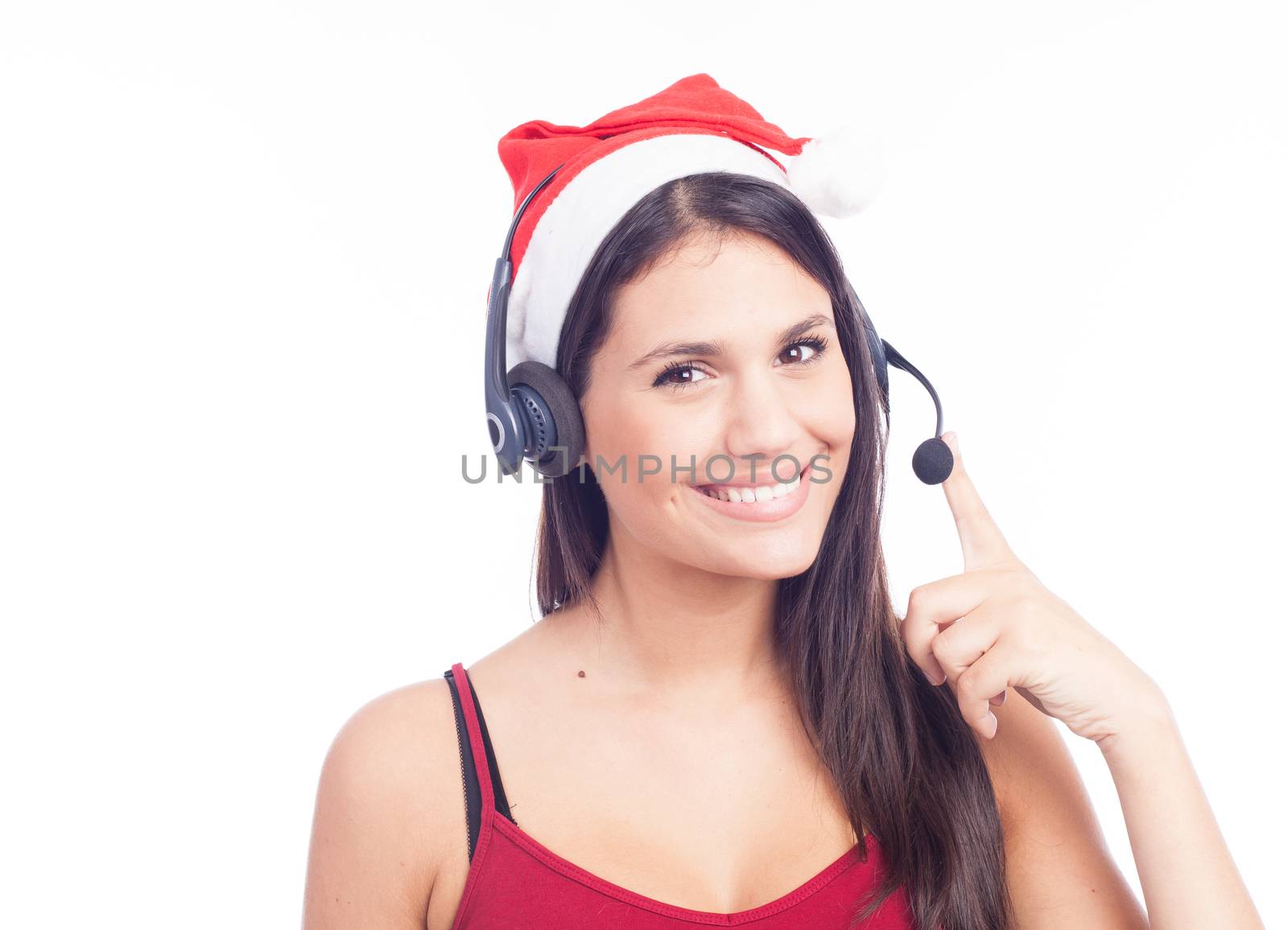 Christmas headset woman from telemarketing call center wearing red santa hat talking smiling isolated on white background.