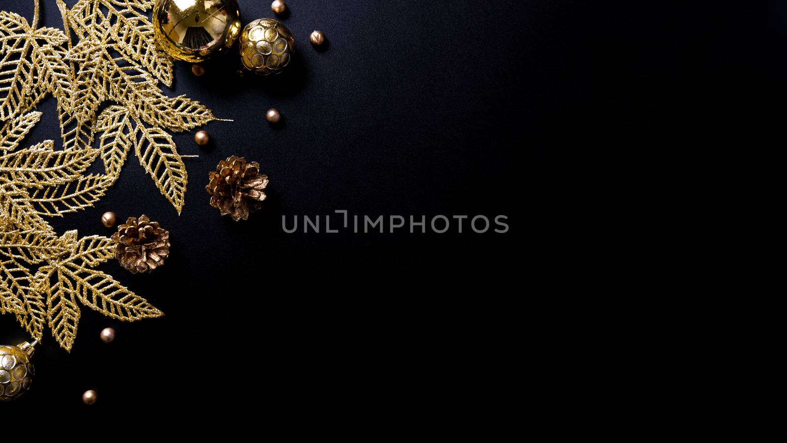 Christmas background. Top view of Christmas decorations on black background with copy space for text. Flat lay, winter, postcard template, new year concept.