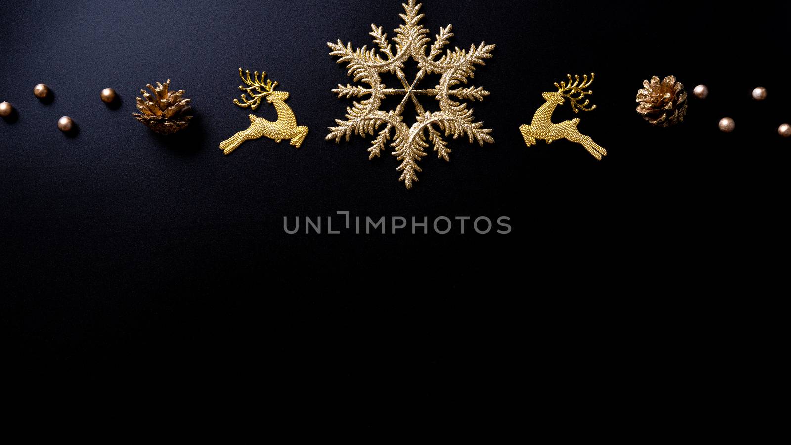 Christmas background. Top view of Christmas decorations on black background with copy space for text. Flat lay, winter, postcard template, new year concept.