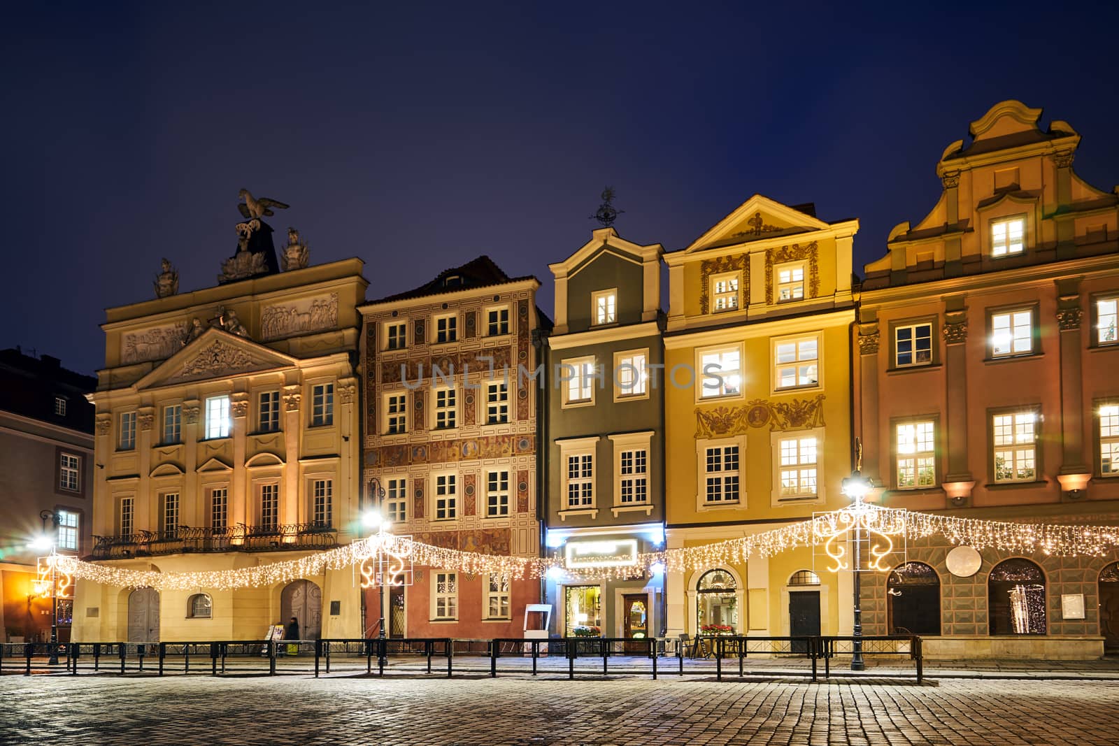 The Market Square with historic tenement houses andl and christmas decorations in city of Poznan