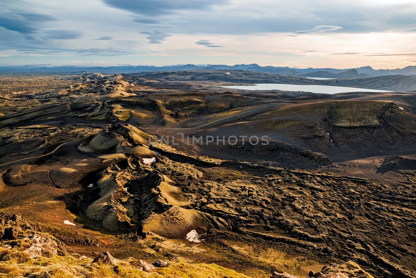 Lakagigar volcanic fissure at sunset illuminated by golden light, Iceland