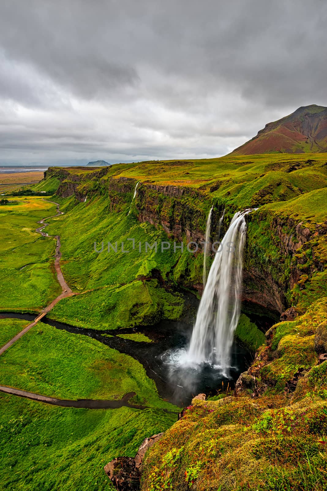 Seljalandsfoss waterfall in a cloudy day seen from above, Iceland