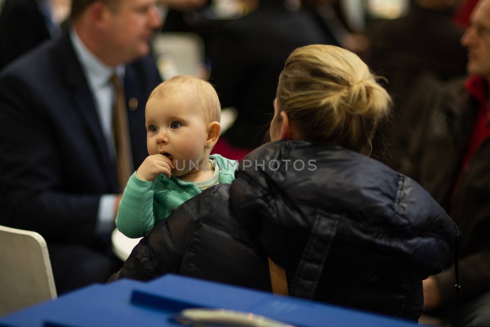 03/04/2018. Brno, Czech Republic. Beautiful small child with her mother while attending an event at the convention trade center in Brno. BVV Brno Exhibition by gonzalobell