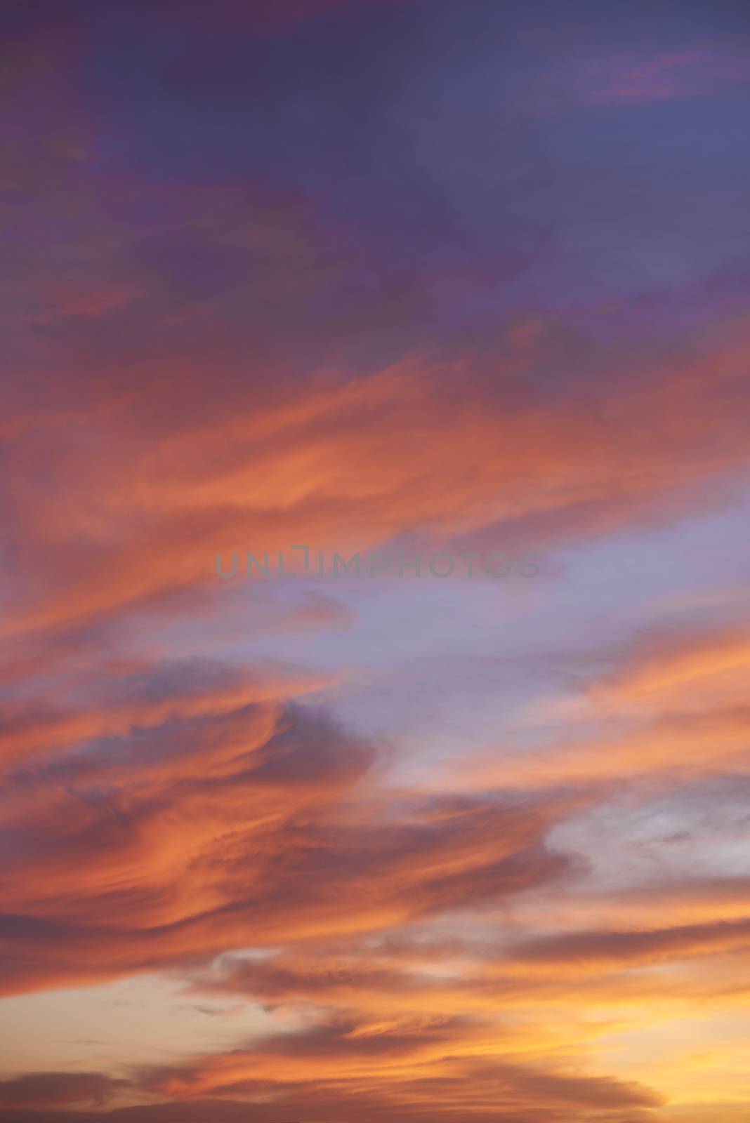 Sunset. Heaven, orange sky. Sun rays. Wallpaper. Clouds.