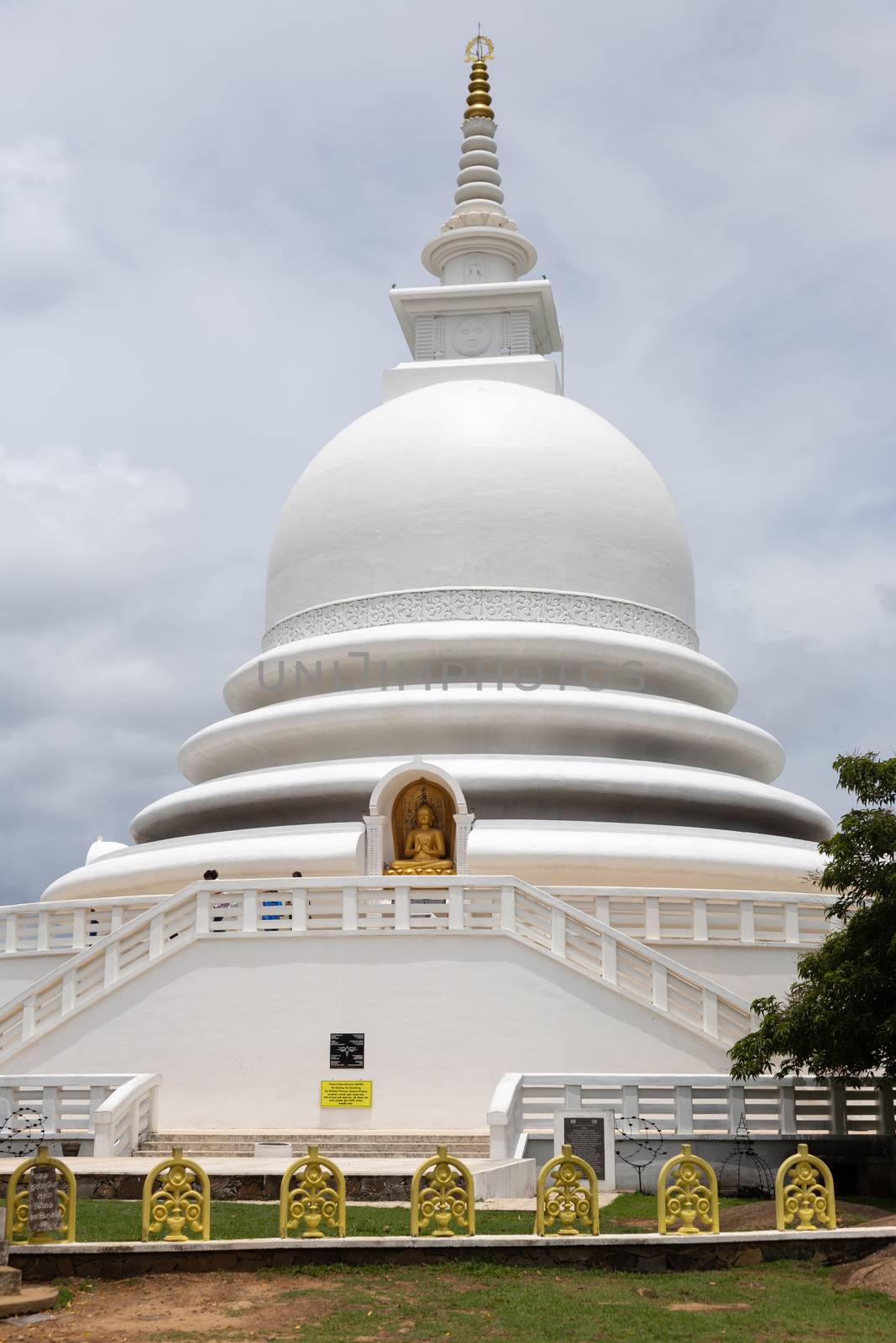 Unawatuna, Sri Lanka 15.4.2018 Japanese Peace Pagoda white temple against blue by kgboxford