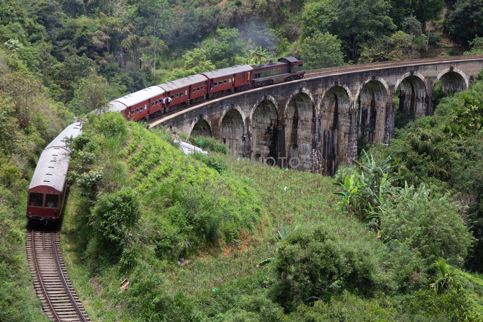 Ella Sri Lanka 4.15.2018 the 9 arch famous Demodara Railway Bridge with train built 100 years ago. High quality photo