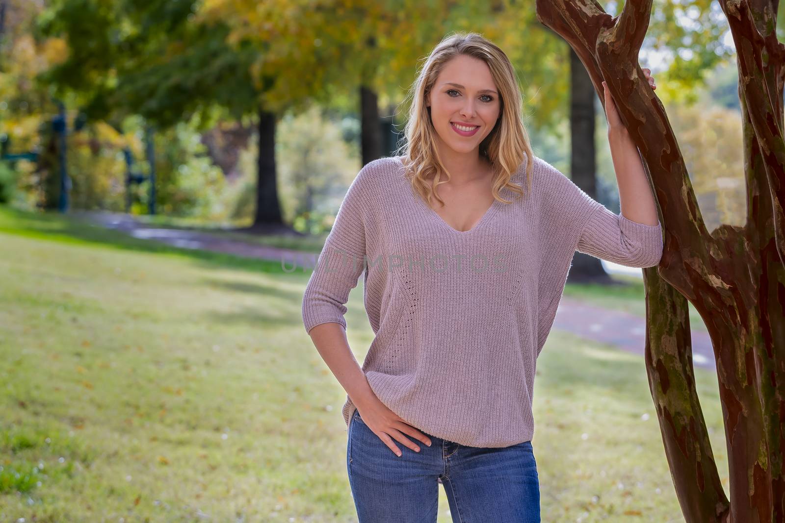 A beautiful Blonde model posing outdoors in an urban environment