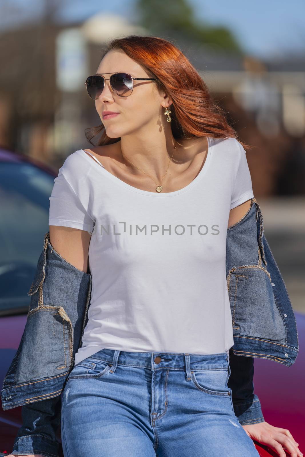 A Lovely Redhead Model Enjoys An Spring Day Outdoors by actionsports