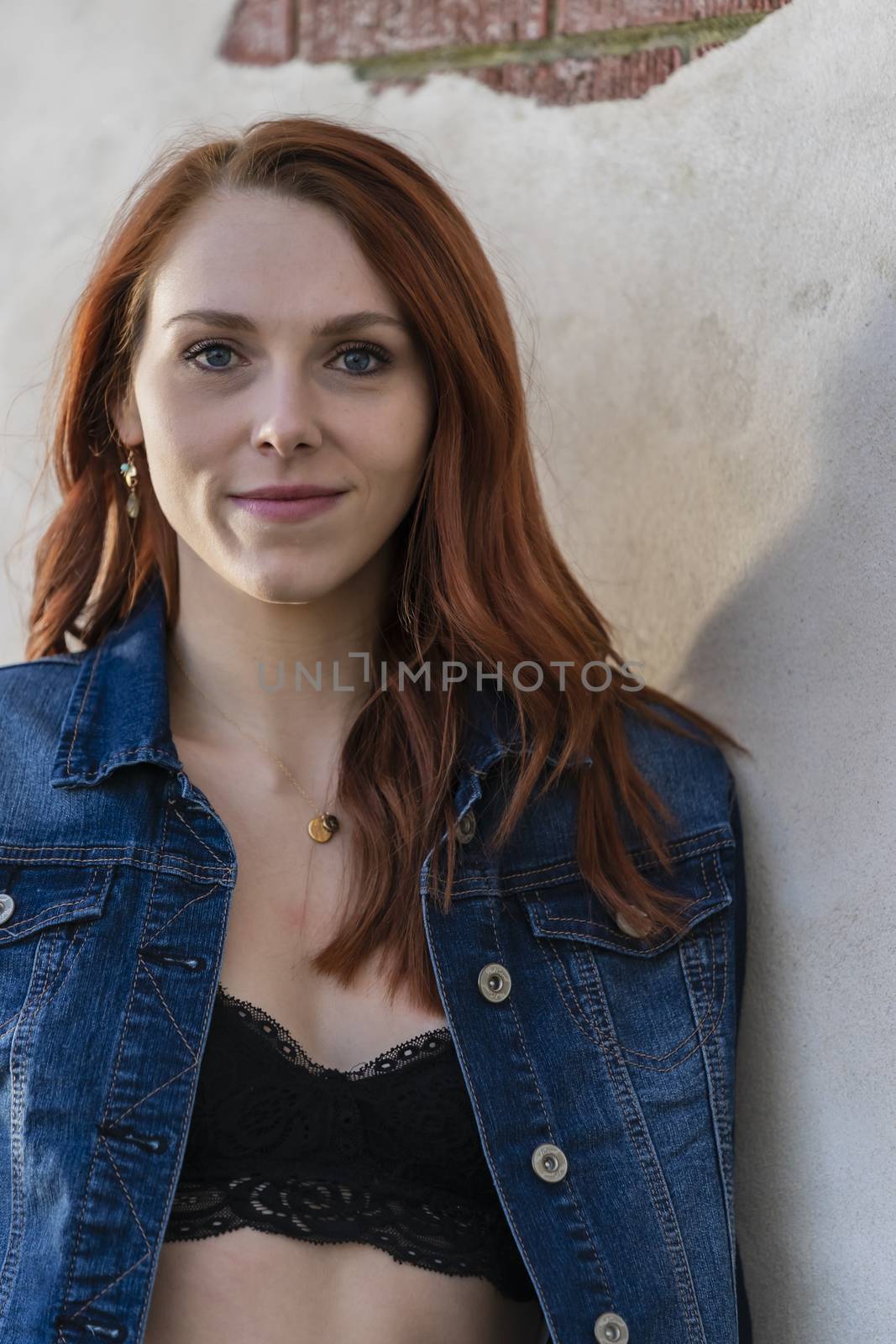 A Lovely Redhead Model Enjoys An Spring Day Outdoors by actionsports