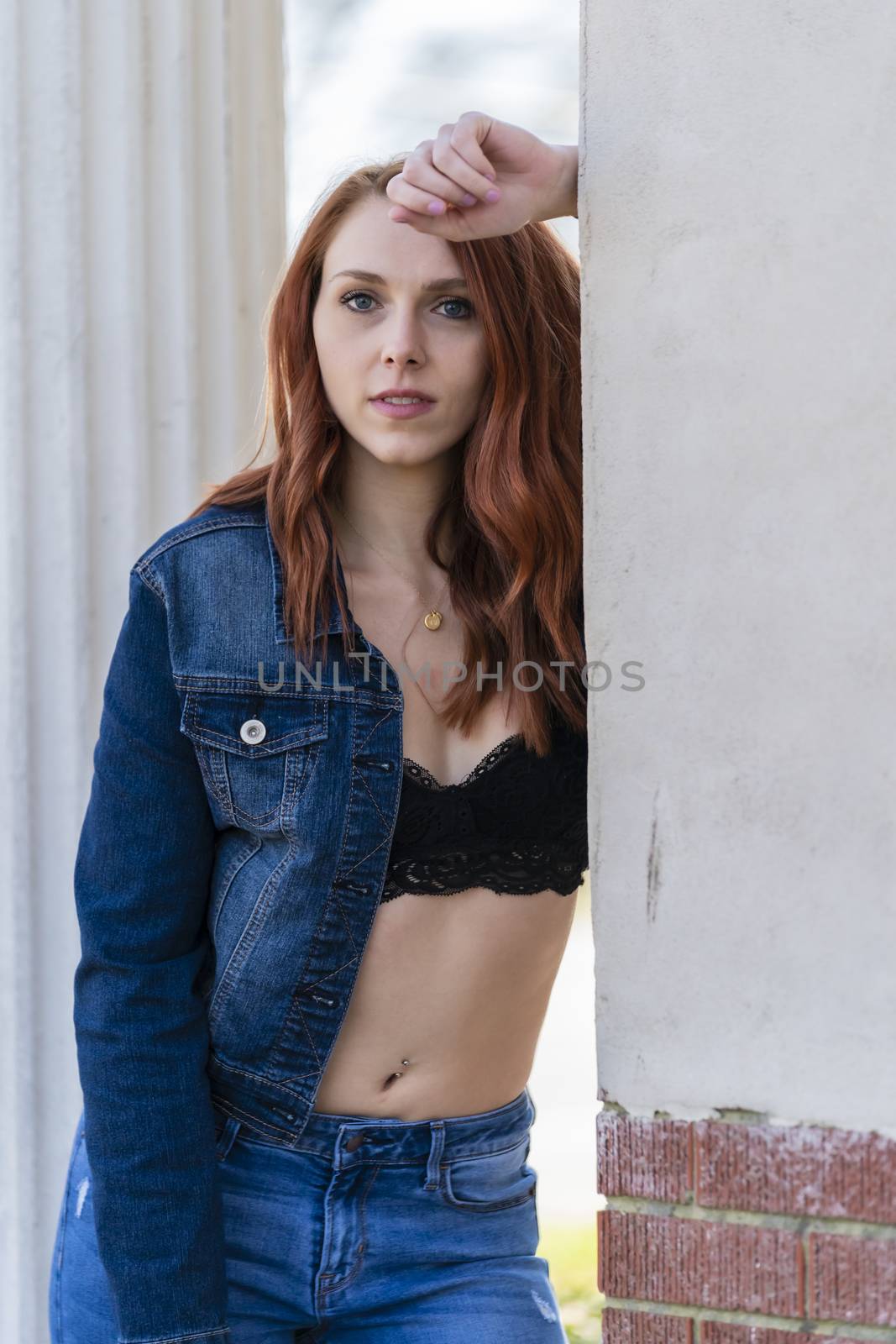 A Lovely Redhead Model Enjoys An Spring Day Outdoors by actionsports