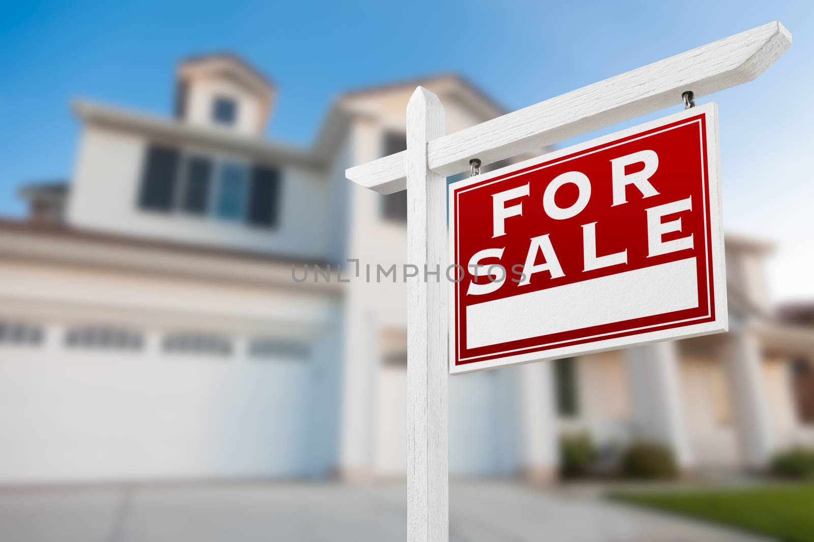 Home For Sale Real Estate Sign in Front of New House.