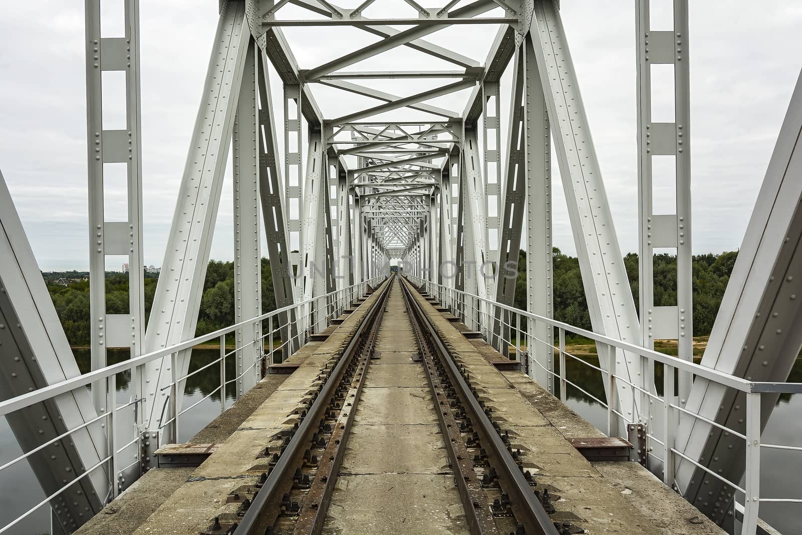 Railroad tracks and sleepers railway bridge and railway bridge across the river