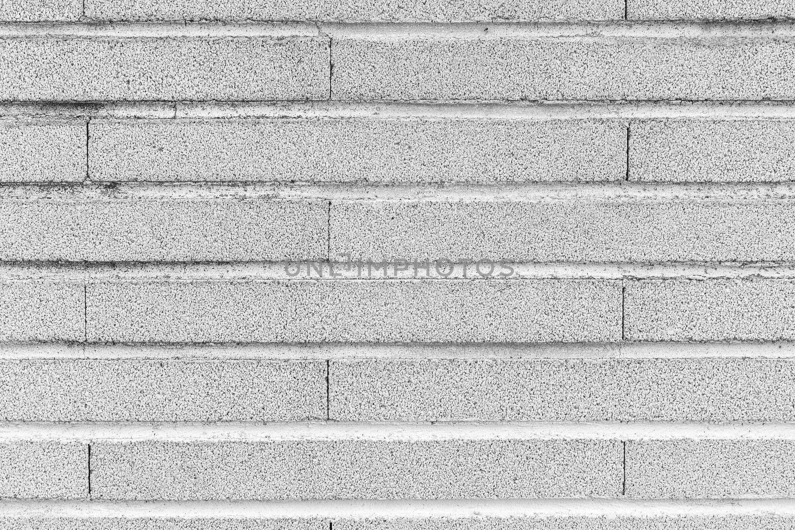 Gray background simulating a brick wall with horizontal masonry