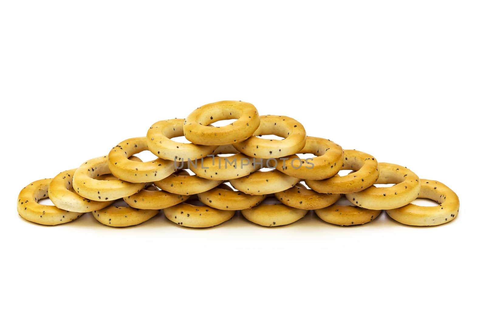 Baranka with poppy seeds stacked on top of each other on a white background
