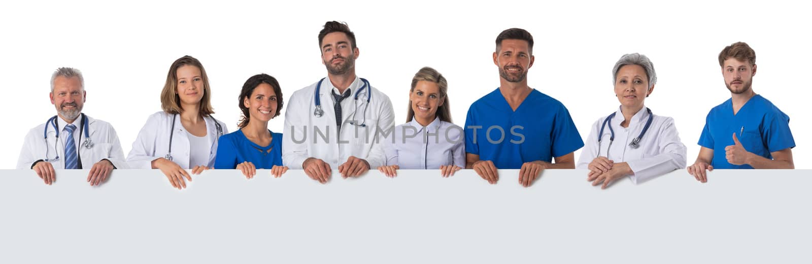 Group of doctors with blank banner isolated over a white background