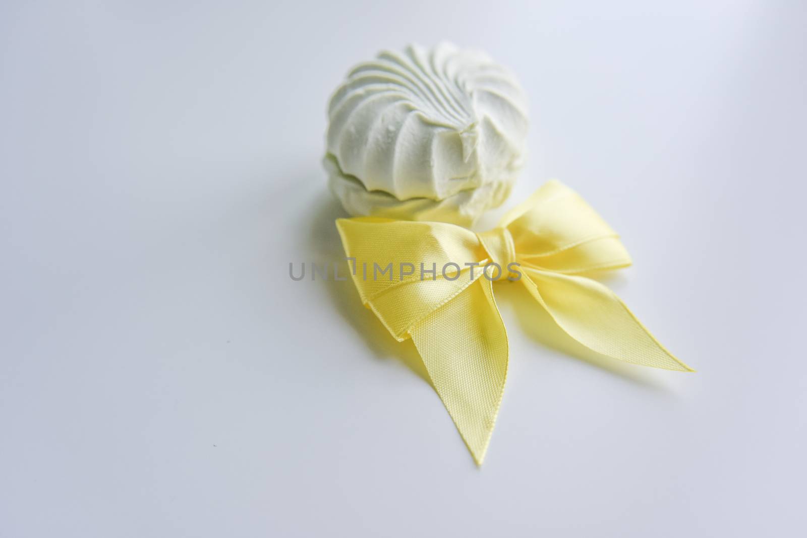 selective focus at the light green marshmallow with yellow ribbo by yulia_sanatina