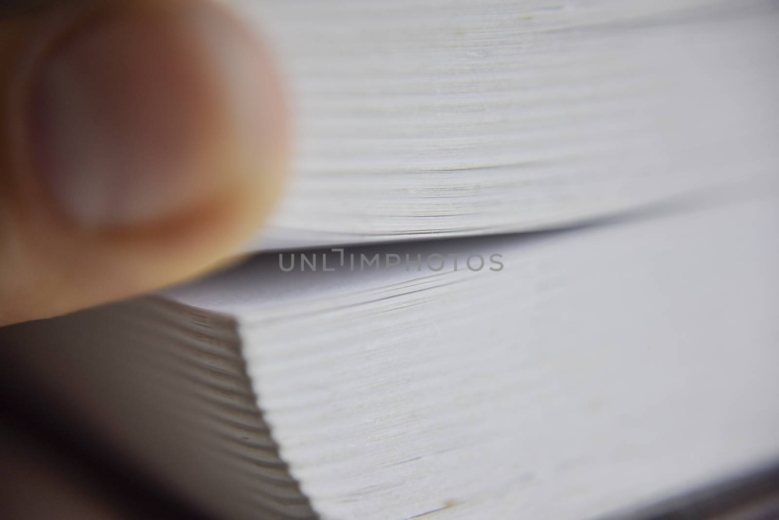 selective focus, macro look at the pages of the thick book, knowledge concept