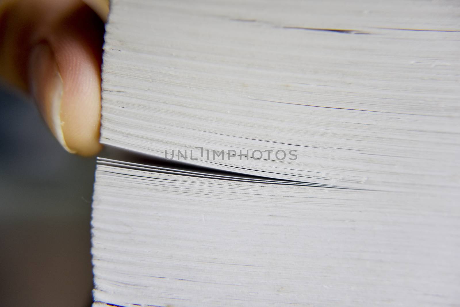 selective focus, macro look at the pages of the thick book by yulia_sanatina