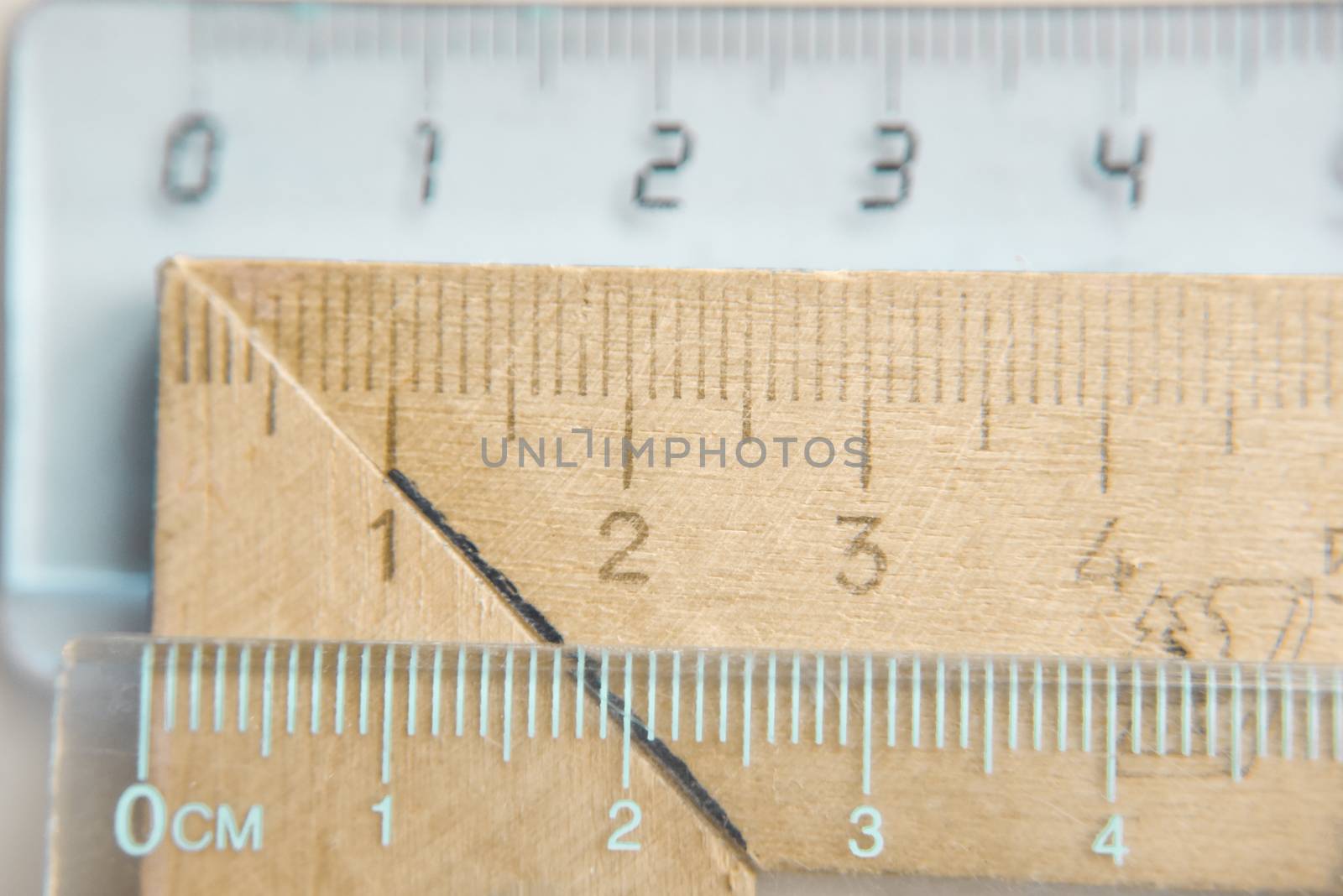 plastic and wooden rulers fragments, selective focus