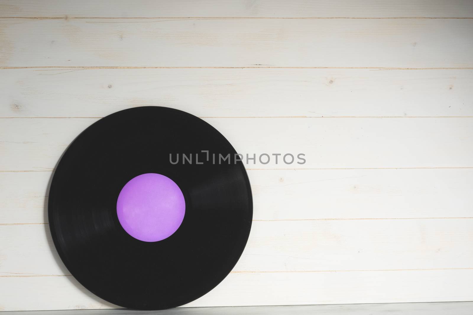 Old violet vinyl record isolated by Robertobinetti70