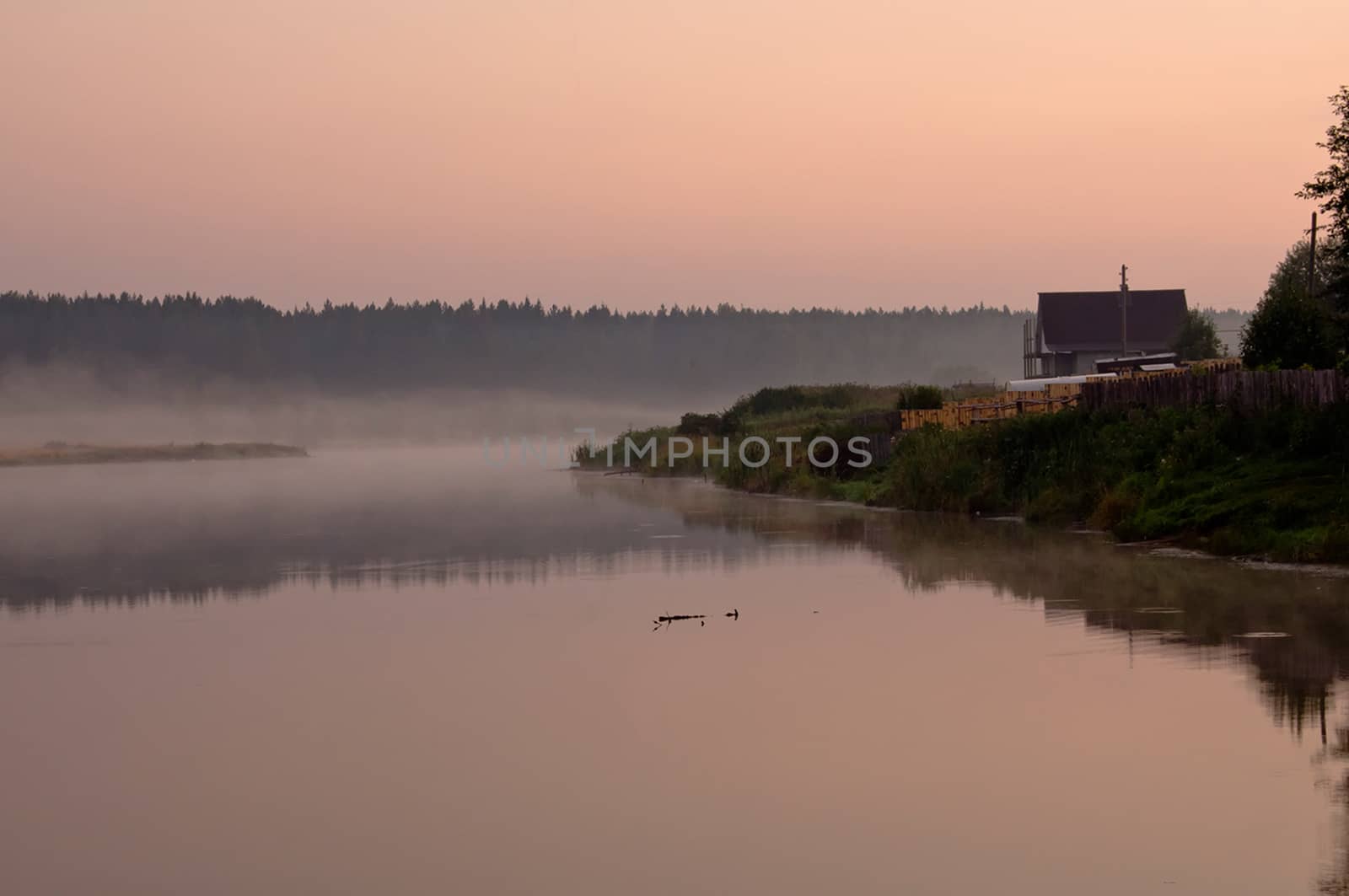 Smoke of mist over the pond. morning mist over the pond.