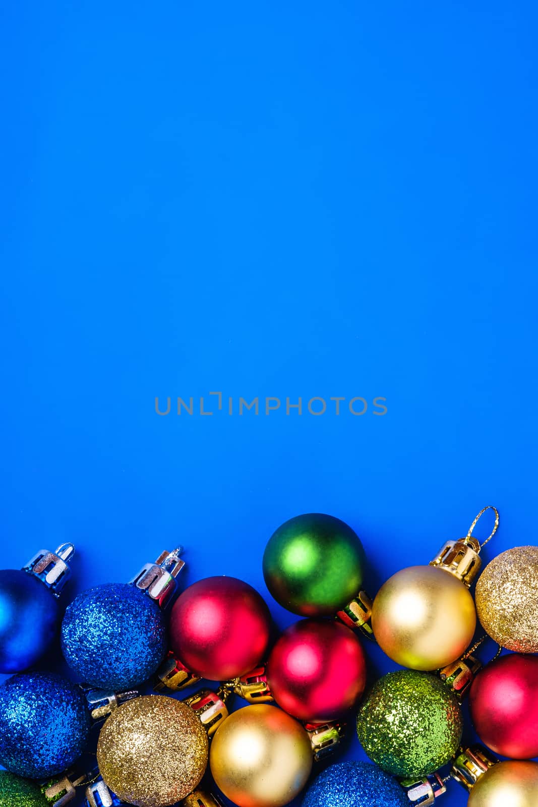 Christmas composition. Blue and golden ornament and baubles decorations. Copy space