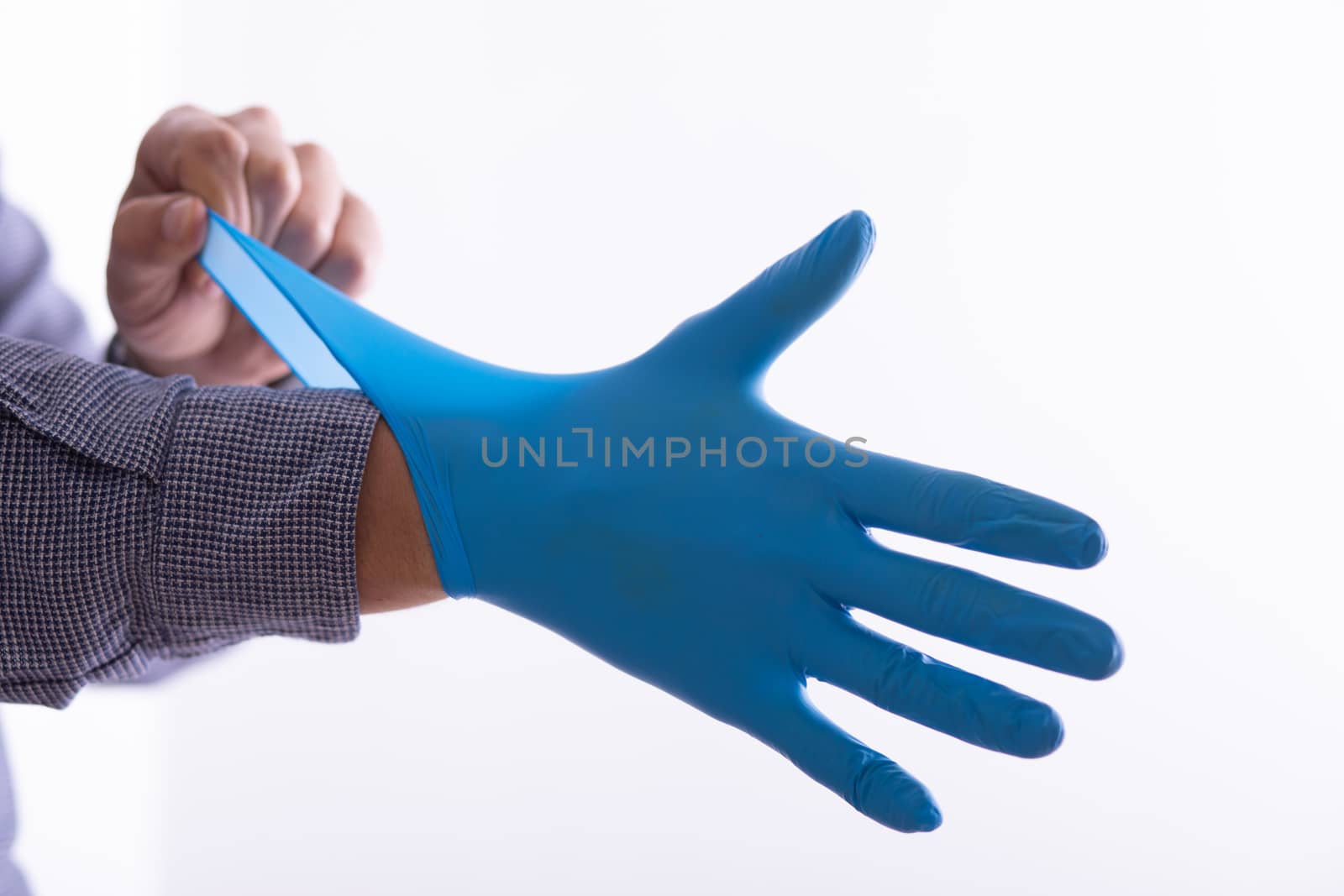 Man Wearing Gloves For Protection From Virus Stock Photo