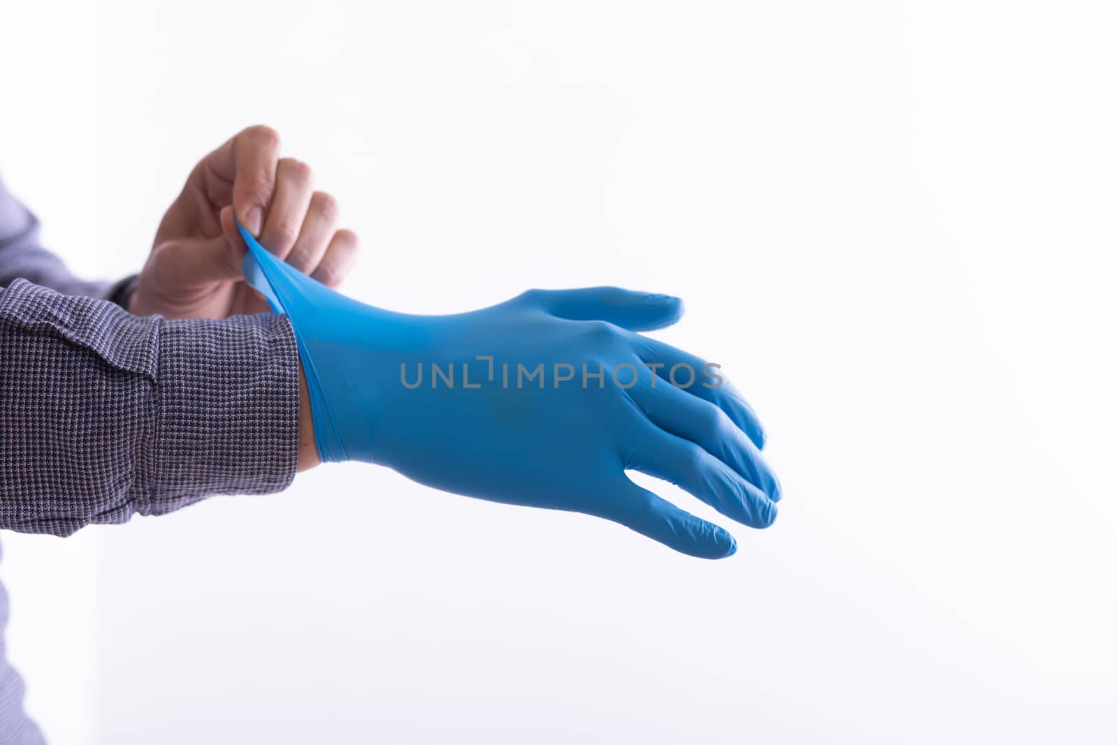 Man Wearing Gloves For Protection From Virus Stock Photo