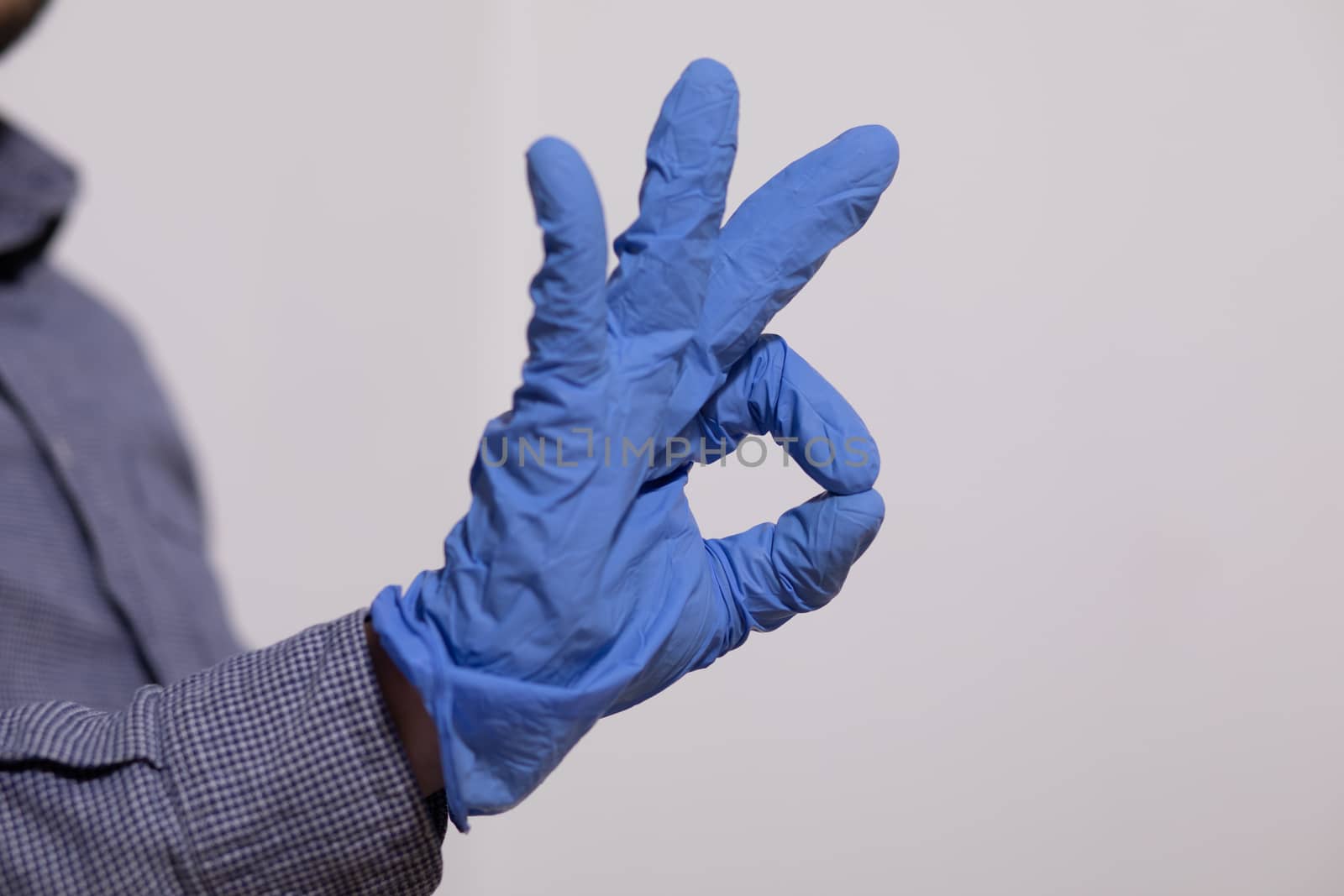 Man showing OK gesture - Everything is just fine in Gloves Stock Photo