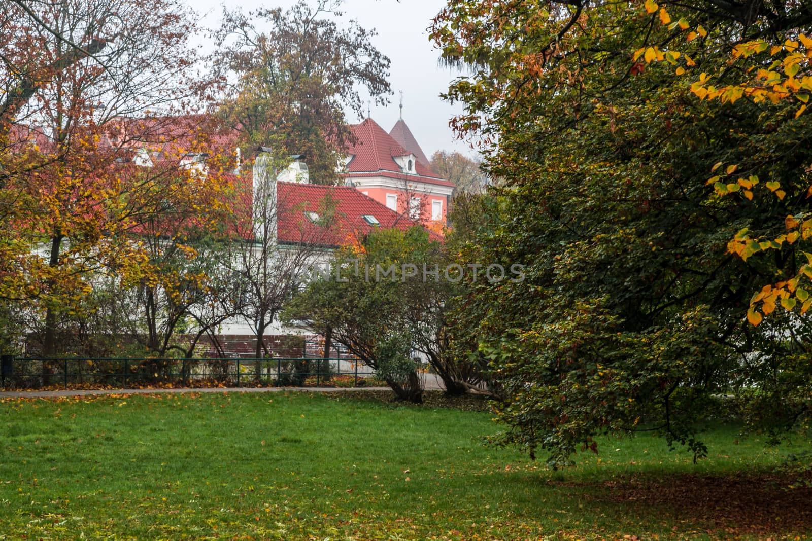 Autumn dawn in historic Prague at Charles Bridge over the Vltava River. Prague, ENESCO monument, Czech Republic