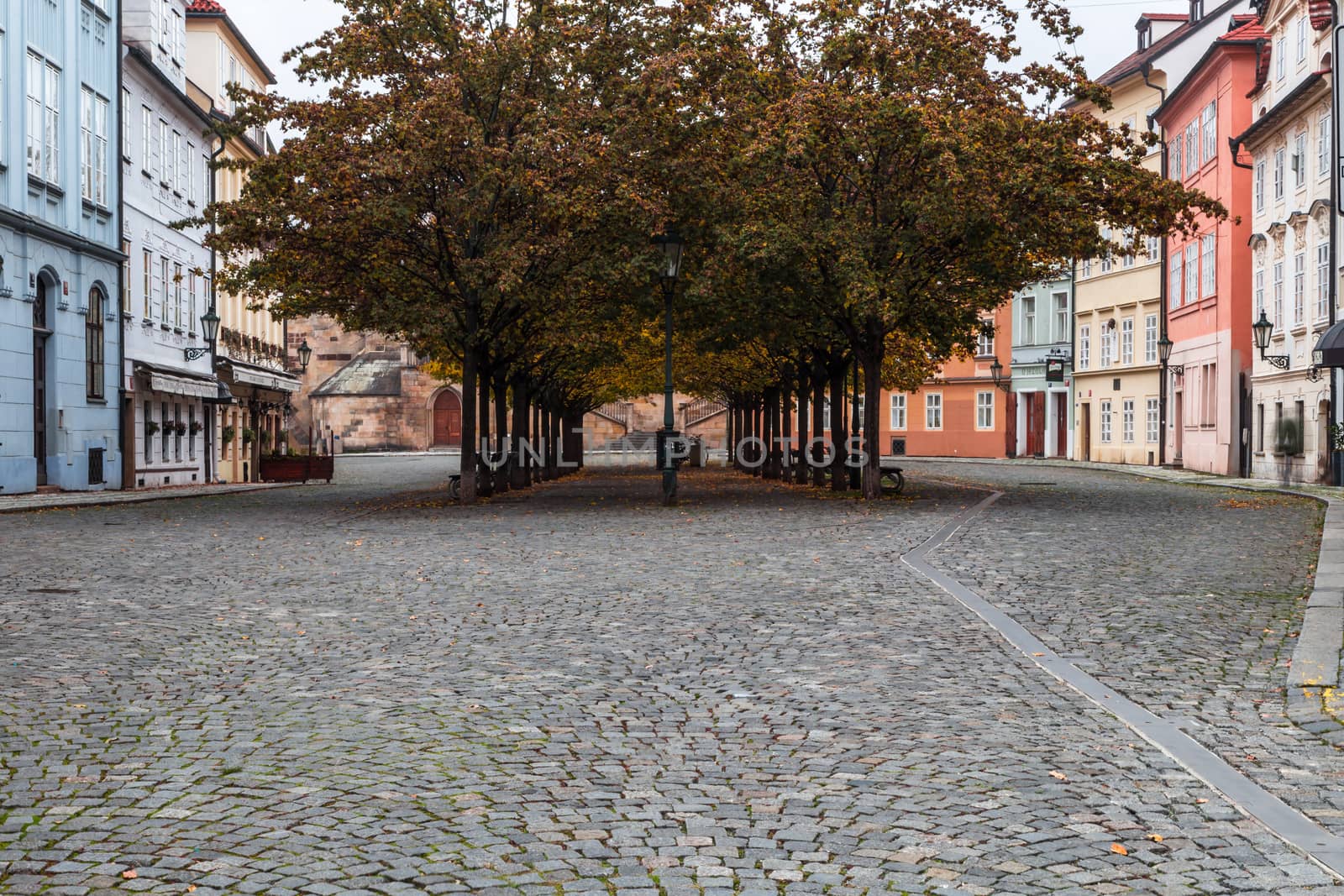 Autumn dawn in historic Prague at Charles Bridge over the Vltava River. Prague, ENESCO monument, Czech Republic