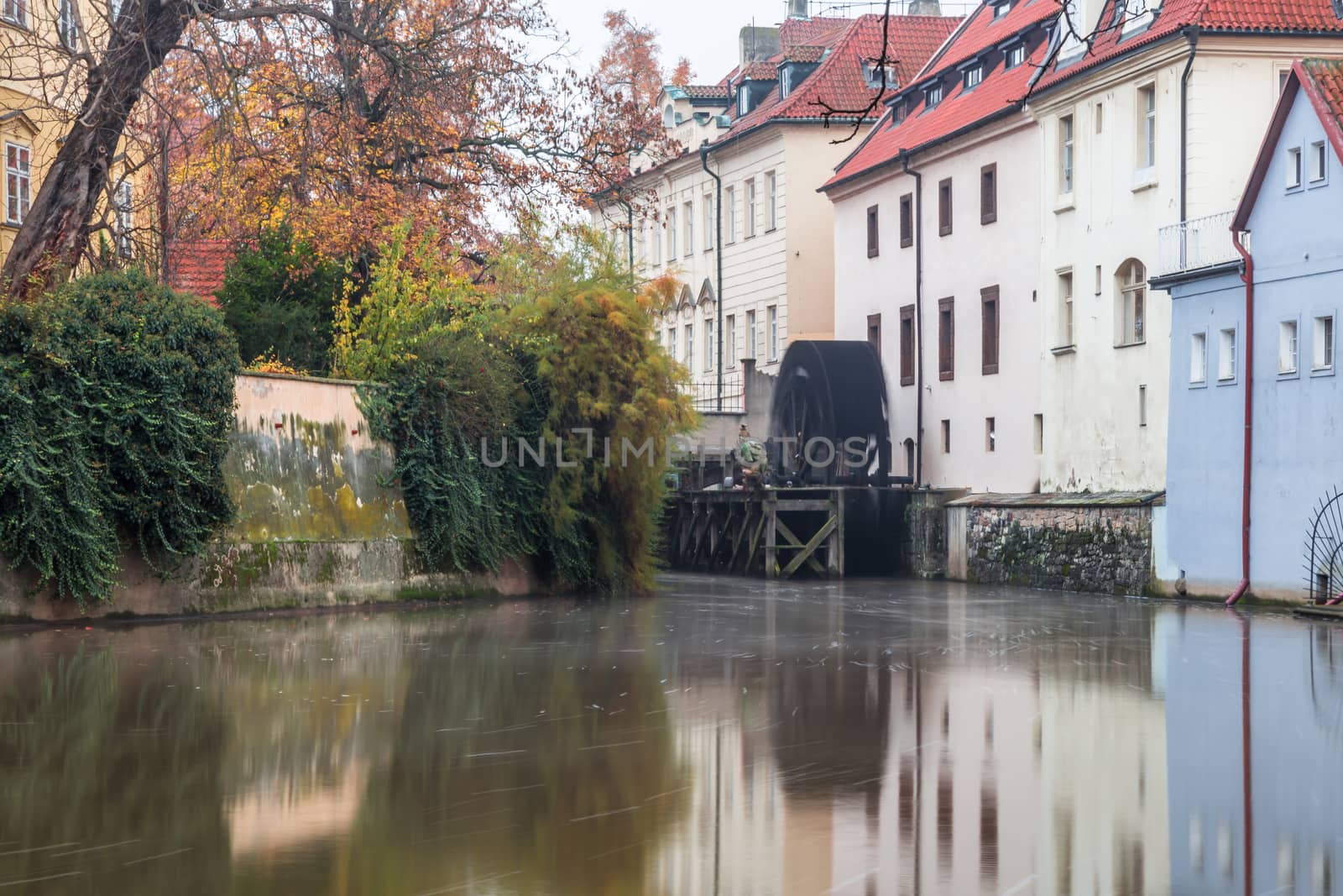 Autumn dawn in historic Prague at Charles Bridge over the Vltava River. Prague, ENESCO monument, Czech Republic